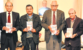 Governor NN Vohra releases a book - Sajda at Raj Bhawan in Jammu on Saturday.