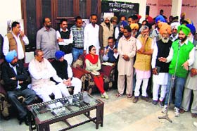 Union Minister Vijay Sampla (2nd from left sitting) listens to residents of Marhi Mustafa village in Moga on Saturday