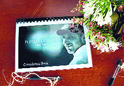 A condolence book is seen next to a flower bouquet prior to a remembrance ceremony at Macksville. 