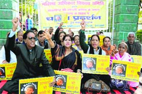 Members of the Mahila Adhikar Vikas Samiti hold a protest at Gandhi Park in Dehradun on Saturday against the rape and murder of a 7-year-old girl